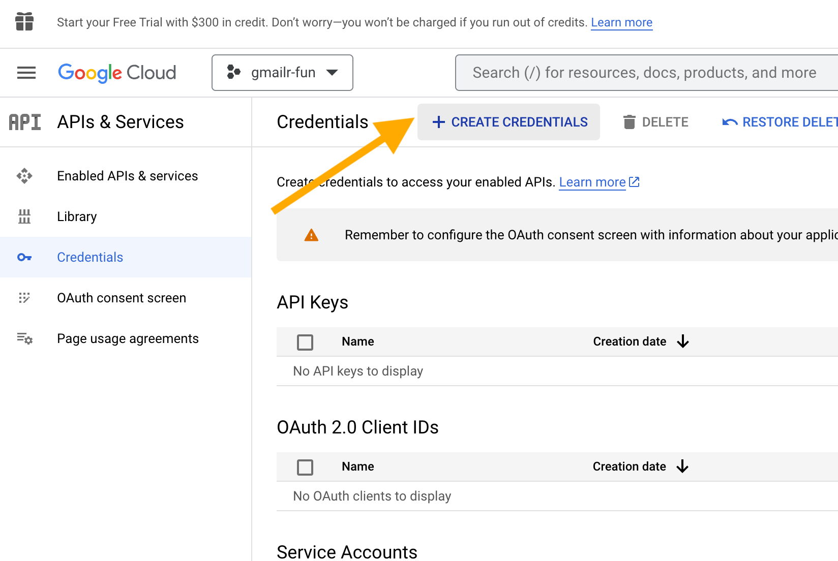 Screenshot with an arrow pointing at the '+ CREATE CREDENTIALS' button.