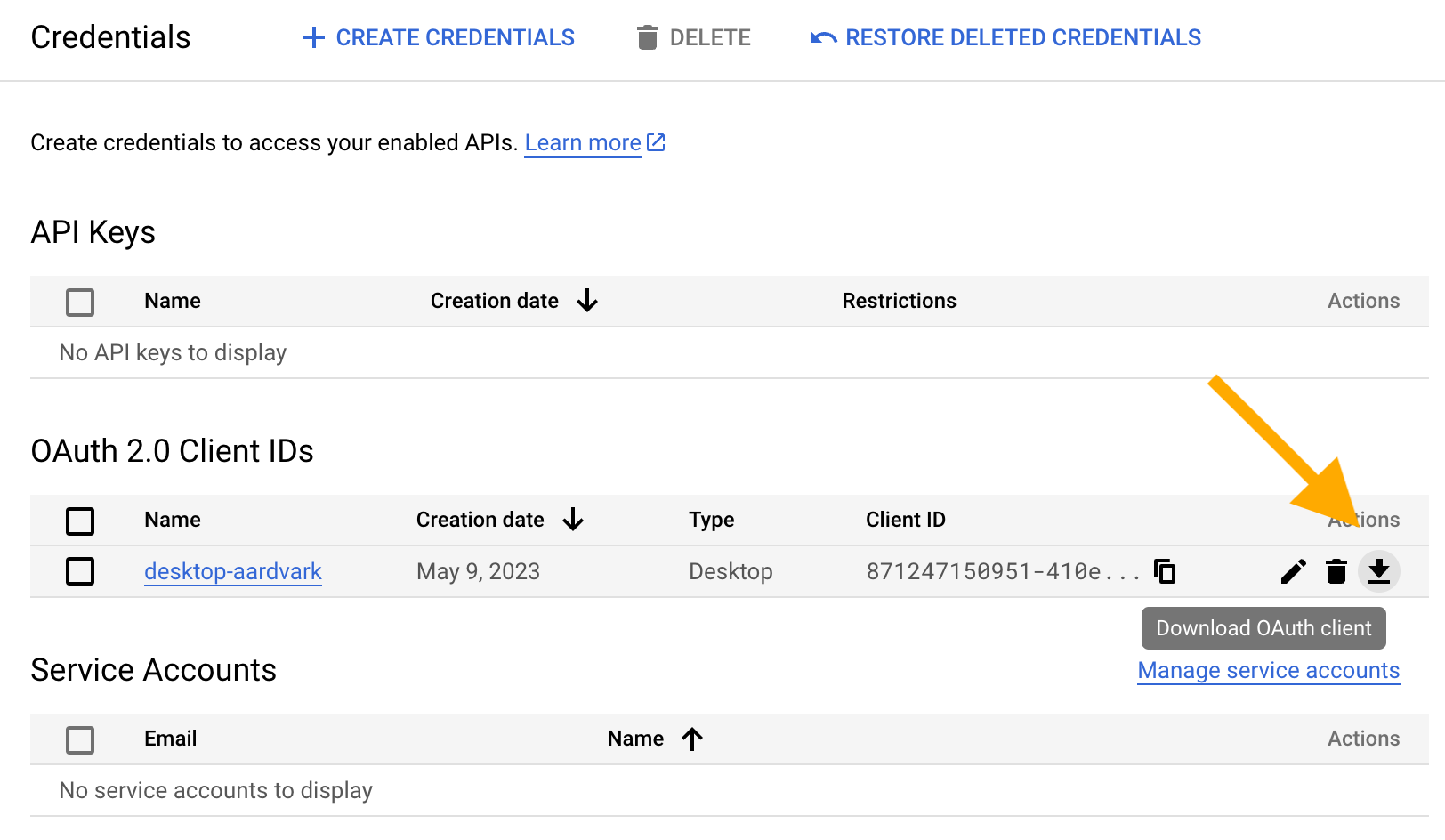 Screenshot of the 'Credentials' screen with an arrow pointing at a 'download' icon in the table row associated with the existing OAuth 2.0
 Client ID named 'desktop-aardvark'.